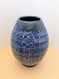 Large blue vase with textured swirls