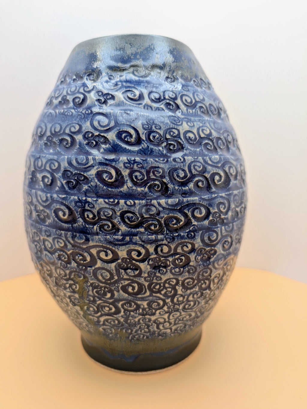 Large blue vase with textured swirls