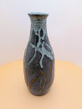 Narrow-neck vase, purple and greenish hues with bare clay accents