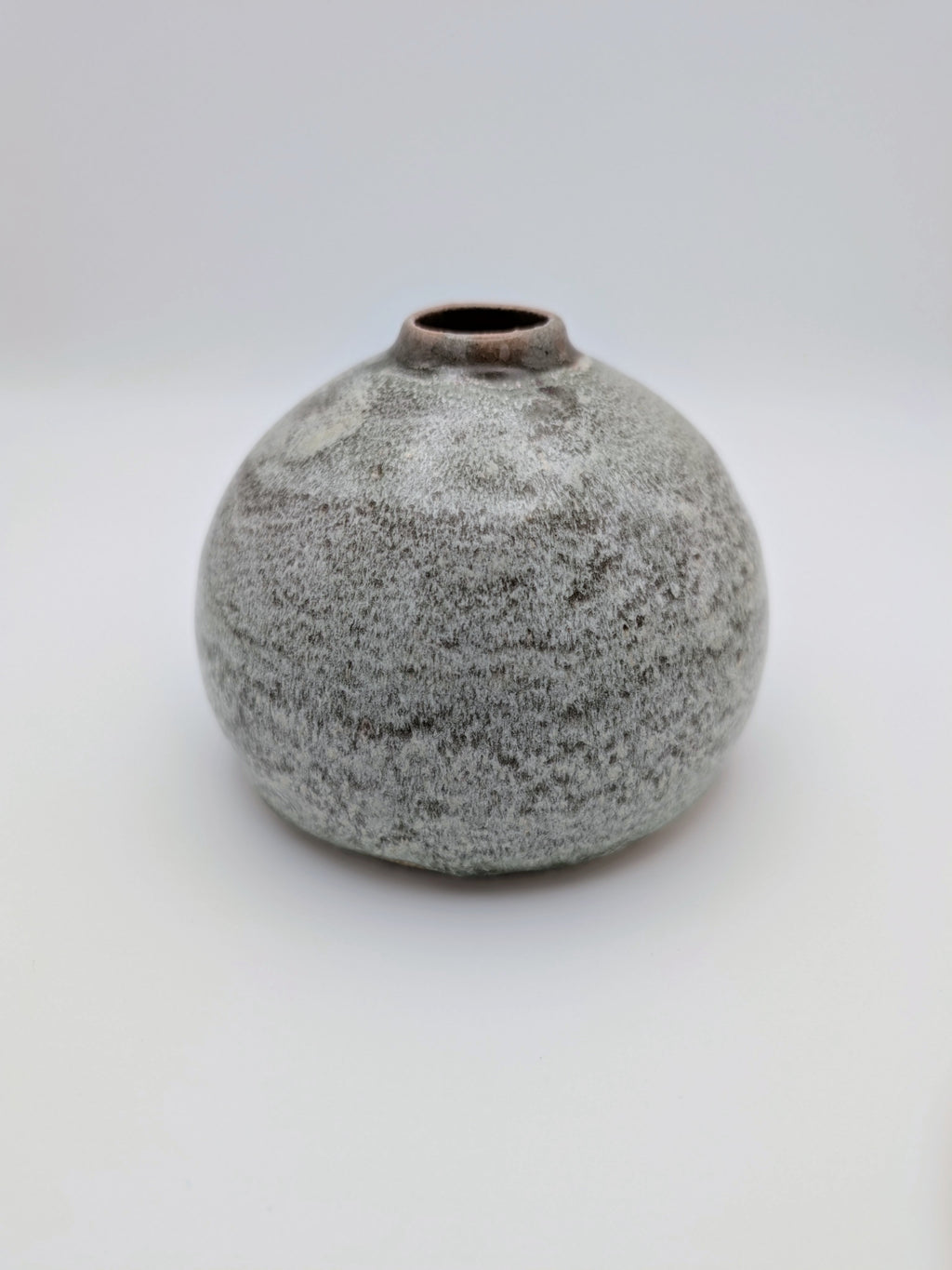 Short, bulbous vase with thick, complex glaze effects