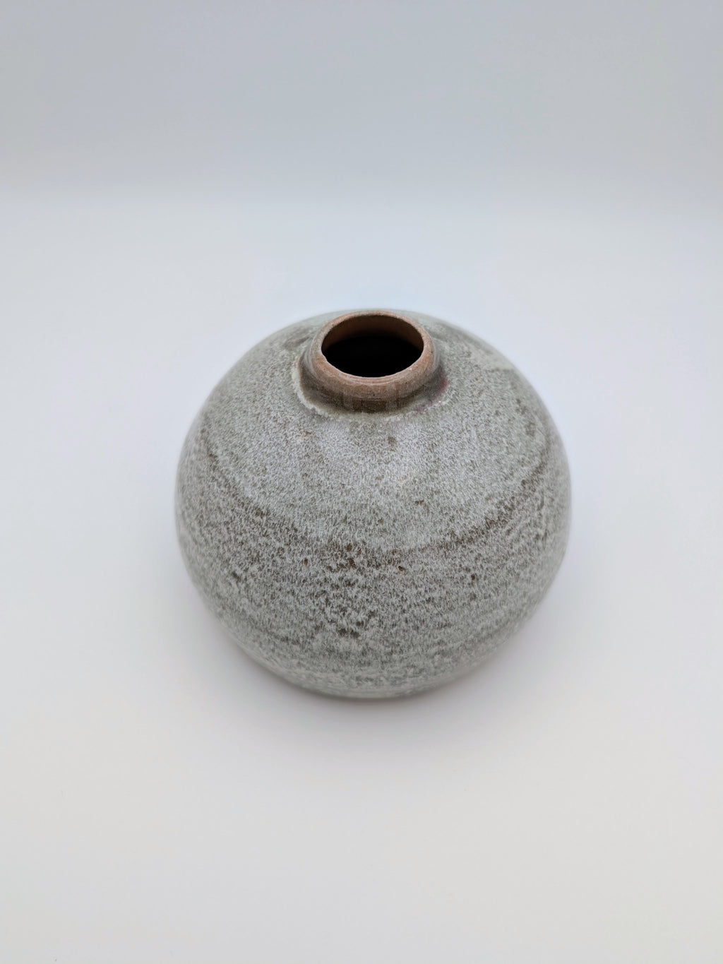Short, bulbous vase with thick, complex glaze effects
