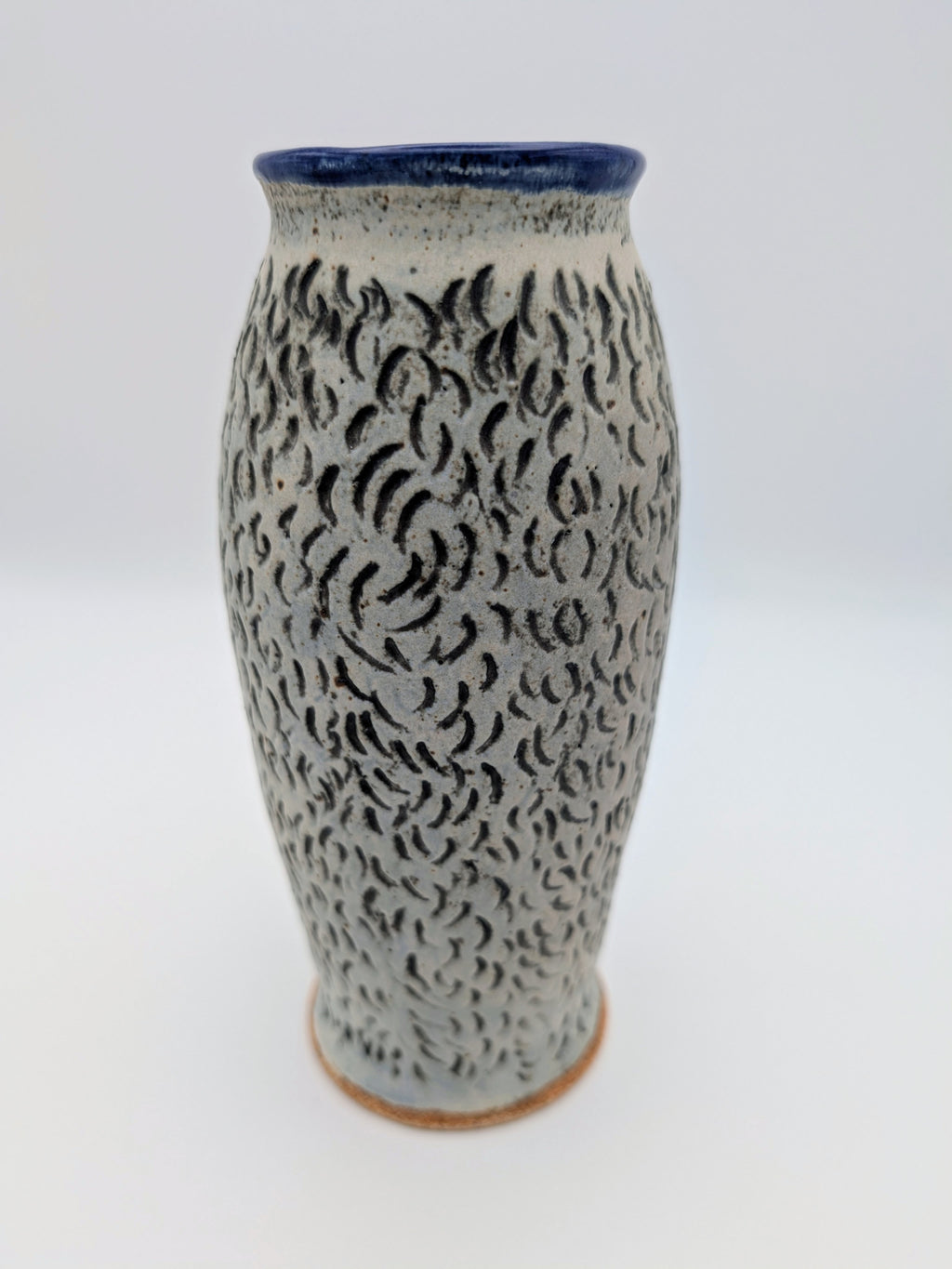 Elegant blue-lined vase with textured, matte exterior