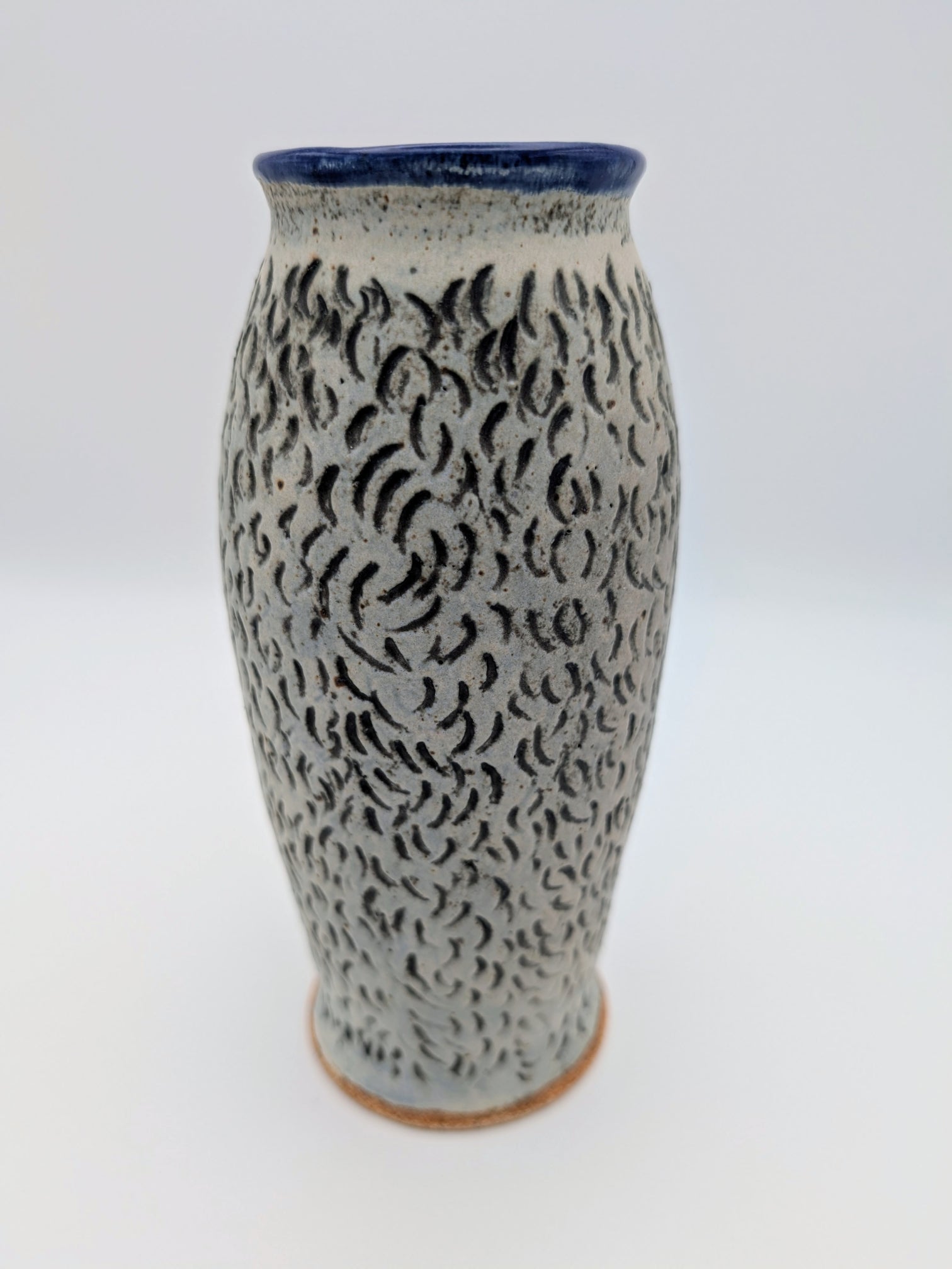 Elegant blue-lined vase with textured, matte exterior